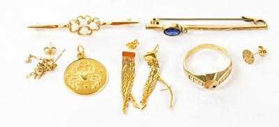 Lot 2459 - A crab pendant stamped 750 together with a 9ct...