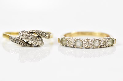 Lot 2427 - An 18ct yellow gold three stone diamond ring,...