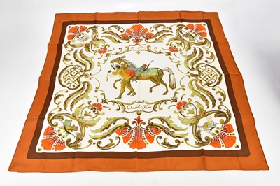 Lot 807 - HERMÈS; a 100% silk brown, cream and gold...