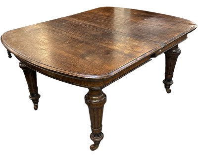 Lot 70 - A Victorian oak extending wind-out dining...
