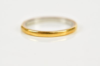 Lot 2426 - A 22ct yellow gold wedding band, size K,...