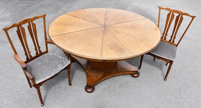 Lot 1419 - A mid century rosewood circular draw-leaf...