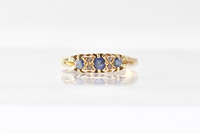 Lot 960 - An 18ct yellow gold ring set with three...