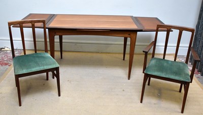 Lot 2042 - A mid century teak extending dining table in...