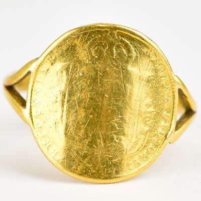 Lot 940 - A 22ct gold ring set with a Victorian half...