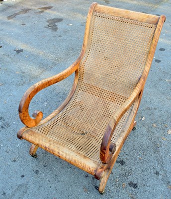 Lot 1672 - An early 19th century canework open sided...