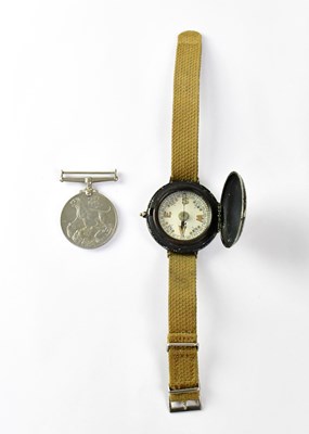 Lot 582 - A military wrist compass on a webbing strap...