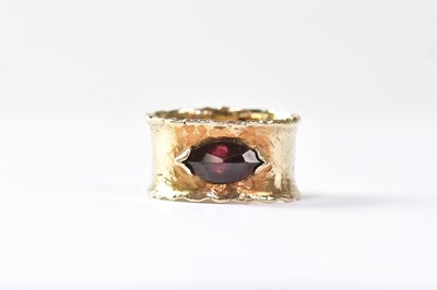 Lot 966 - A 9ct yellow gold wide band ring set with a...