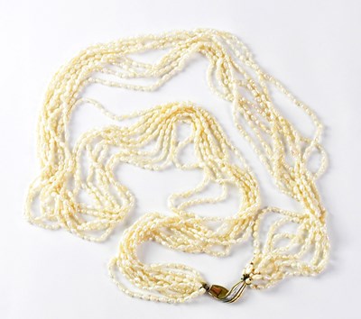 Lot 1010 - An eight-strand natural seed pearl necklace...