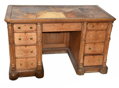 Lot 1701 - A 19th century oak knee-hole desk with brown...