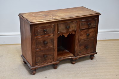 Lot 22 - A small Victorian kneehole seven drawer...