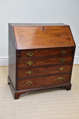 Lot 16 - A 19th century mahogany bureau, the fall front...
