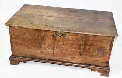 Lot 1501 - An 18th century oak blanket chest with hinged...