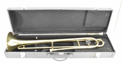 Lot 826 - A brass trombone, in hard carry case, marked...