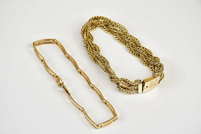 Lot 440 - A yellow metal bracelet with Greek key style...