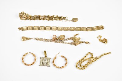 Lot 2487 - A 9ct yellow gold gate link bracelet, a yellow...