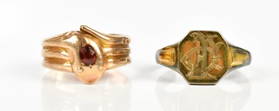 Lot 2430 - A 9ct yellow gold garnet set ring in the form...