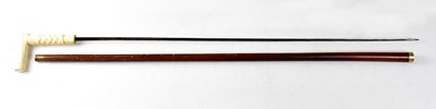 Lot 529 - A Victorian malacca shafted yellow metal...