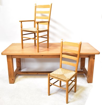 Lot 51 - A large pine kitchen/dining table with square...