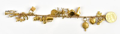 Lot 2483 - A 9ct charm bracelet containing a selection of...