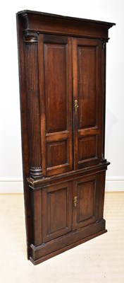 Lot 13 - A George III oak corner cupboard, with two...