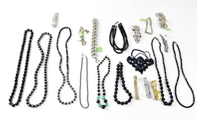 Lot 1046 - Four jet cut glass bead necklaces, together...