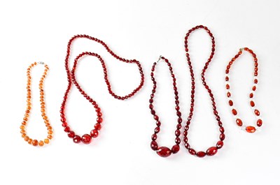 Lot 1030 - Three sets of cherry amber style facet cut...