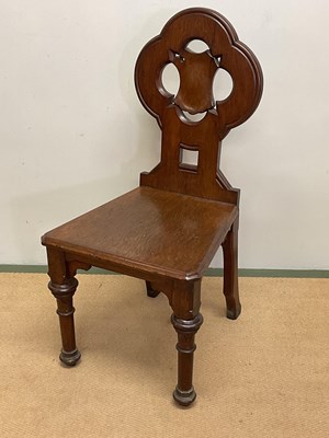 Lot 675 - A mahogany hall chair with carved detail,...
