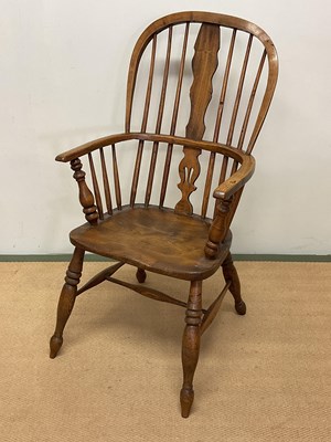 Lot 676 - An oak Windsor chair, height 100cm.