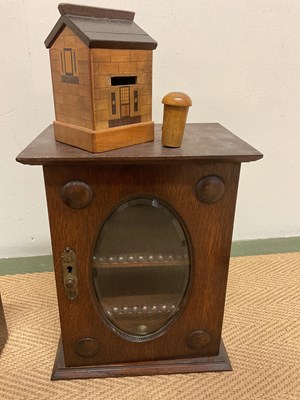 Lot 12 - An oak smoker's cabinet with glass drawer to...