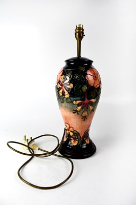 Lot 294 - MOORCROFT; a large baluster lamp with tube...
