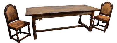Lot 51 - A reproduction oak refectory dining table on...