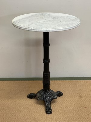 Lot 602 - A marble topped table with metal base, height...