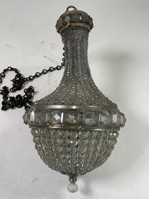 Lot 572 - A 20th century crystal beaded basket...