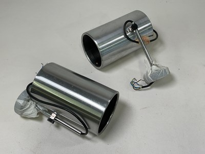 Lot 580 - A pair of polished steel adjustable spotlights.