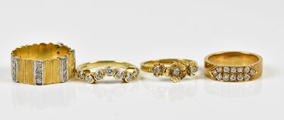 Lot 2393 - An 18ct yellow gold diamond set floral dress...