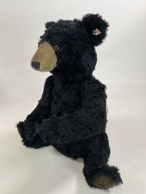 Lot 65 - STEIFF; a large black bear, white tag 664618...