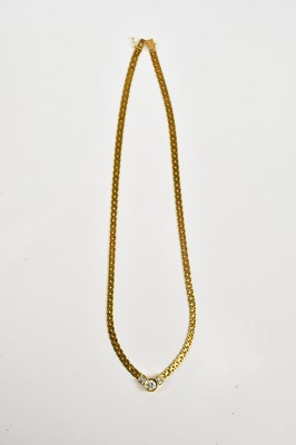 Lot 2448 - A yellow metal diamond set necklace stamped...