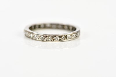 Lot 2417 - A white metal diamond set eternity ring, size...