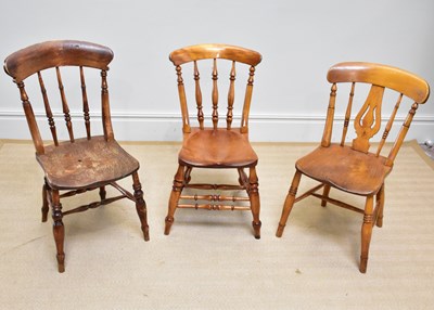 Lot 25 - Three 19th century kitchen Windsor chairs...