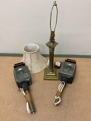 Lot 589 - A brass table lamp and two converted carriage...