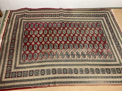 Lot 597 - A large rug, 340 x 240cm (af).