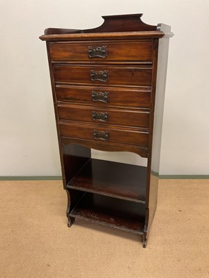 Lot 708 - A stained pine five drawer music cabinet,...