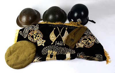 Lot 544 - Five WWII military hats and helmets to include...