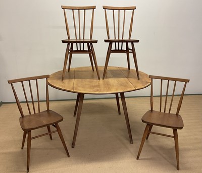 Lot 639 - ERCOL; a beechwood and elm drop-leaf table...