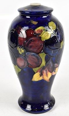 Lot 865 - MOORCROFT; an inverted baluster form table...