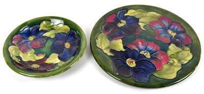 Lot 867 - MOORCROFT; a circular charger decorated in the...