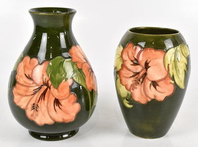 Lot 859 - MOORCROFT; two vases decorated in the...