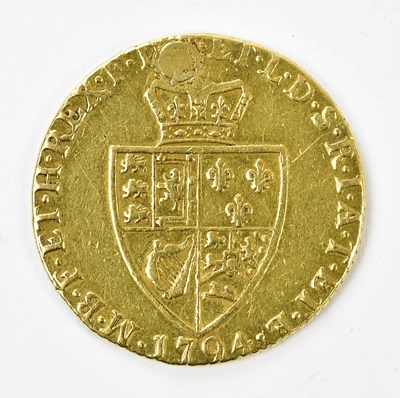 Lot 2364 - A George III gold spade guinea, 1794 (drilled...