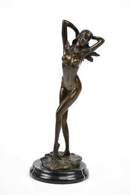 Lot 1709 - A decorative bronze figure of a female nude,...